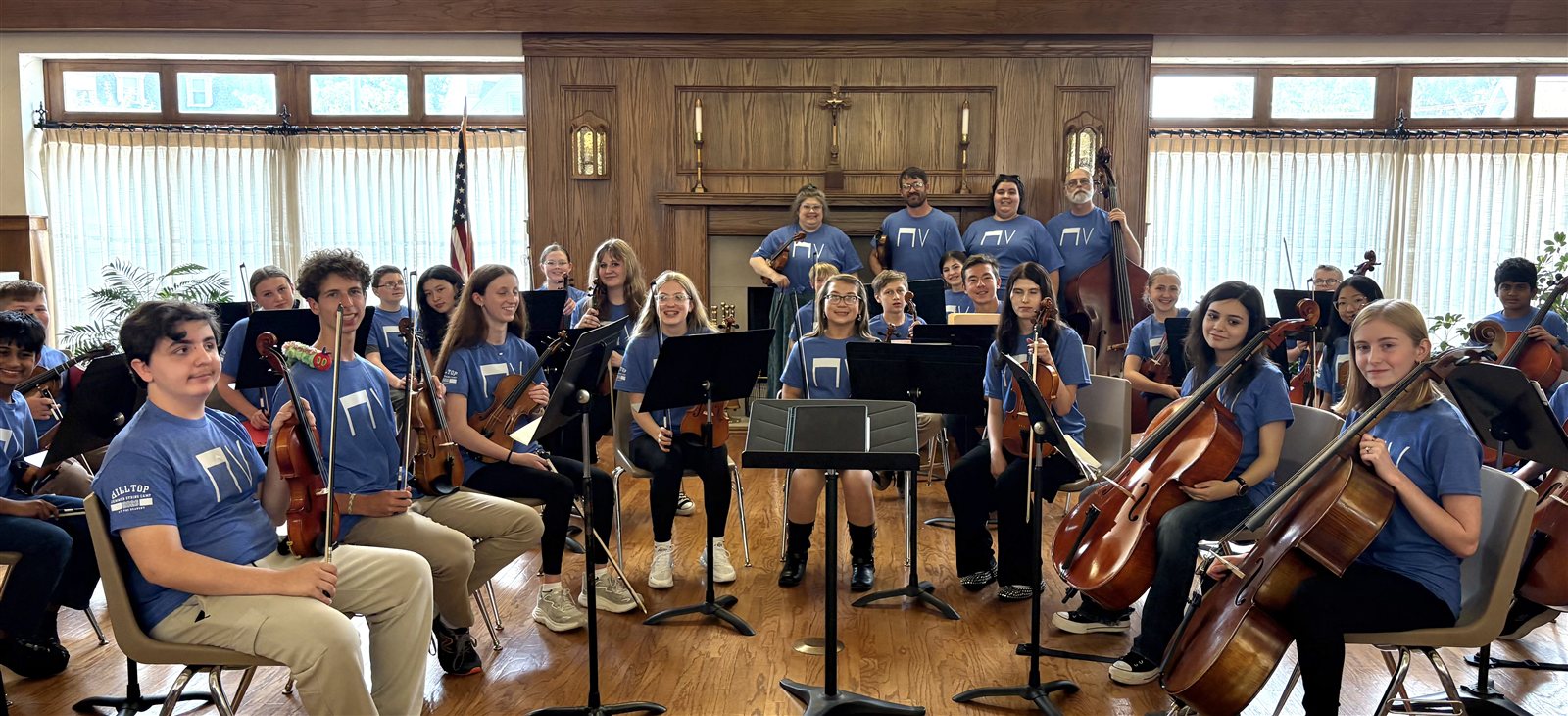 The Hilltop Summer String Camp orchestra of young violinists, cellists, and bassists with their teachers at The Deanery